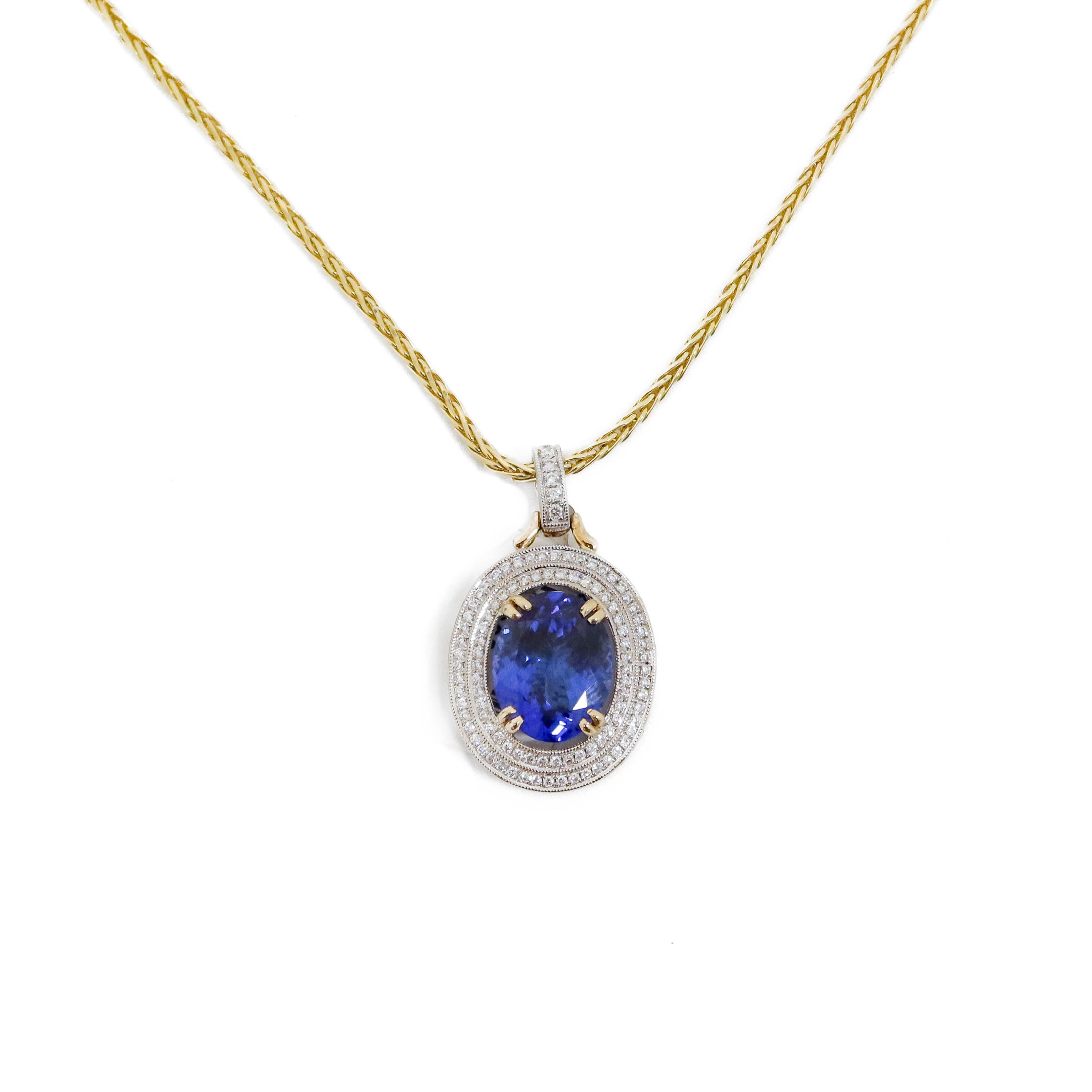 Two Tone Oval Tanzanite and Halo Diamond Pendant